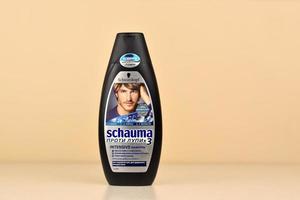 KHARKOV, UKRAINE - MAY 3, 2022 Schwarzkopf schauma shampoo plastic bottle for men. Cosmetics company Hans Schwarzkopf GmbH was acquired by Henkel in 1995 photo