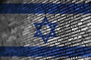 Israel flag is depicted on the screen with the program code. The concept of modern technology and site development photo