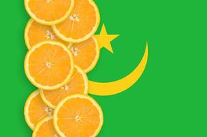 Mauritania flag and citrus fruit slices vertical row photo