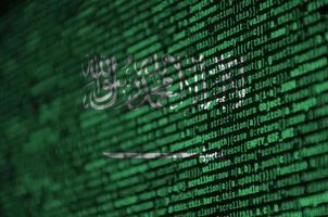 Saudi Arabia flag is depicted on the screen with the program code. The concept of modern technology and site development photo