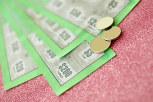 Close up view of green lottery scratch cards. Many used fake instant lottery tickets with gambling results. Gambling addiction photo