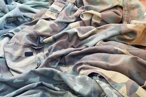 Camouflage background texture as backdrop for military video games and design projects photo