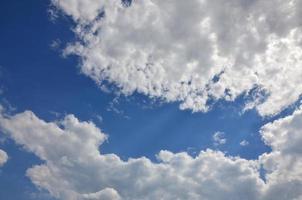 Beautiful blue sky background template with some space for input text message below isolated on blue photo