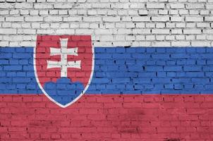 Slovakia flag is painted onto an old brick wall photo