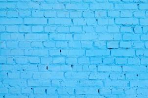 Square brick block wall background and texture. Painted in blue photo