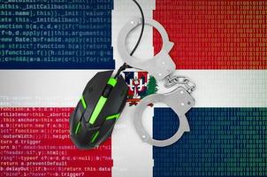Dominican Republic flag and handcuffed computer mouse. Combating computer crime, hackers and piracy photo