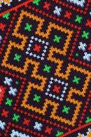 Traditional Ukrainian folk art knitted embroidery pattern on textile fabric photo