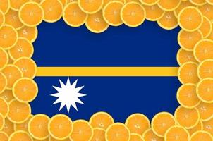 Nauru flag in fresh citrus fruit slices frame photo