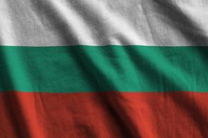 Bulgaria flag with big folds waving close up under the studio light indoors. The official symbols and colors in banner photo