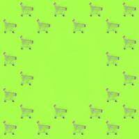 Shopping addiction, shopping lover or shopaholic concept. Many small empty shopping carts perform a pattern on a pastel colored paper background. Flat lay composition, top view photo
