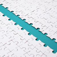 The blue path is laid on the platform of a white folded jigsaw puzzle. Texture image with copy space for text photo