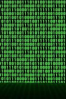 An image of a binary code made up of a set of green digits on a black background photo