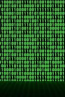 An image of a binary code made up of a set of green digits on a black background photo