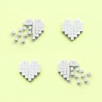 A few hearts made of sugar cubes lies on a trendy pastel lime photo