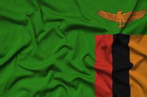 Zambia flag is depicted on a sports cloth fabric with many folds. Sport team banner photo