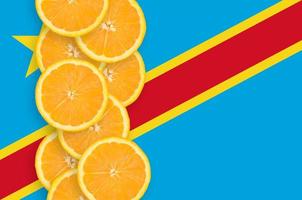 Democratic Republic of the Congo flag and citrus fruit slices vertical row photo