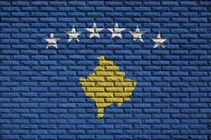 Kosovo flag is painted onto an old brick wall photo