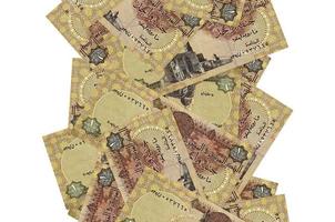 1 Egyptian pound bills flying down isolated on white. Many banknotes falling with white copyspace on left and right side photo