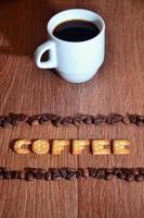 English word Coffee, made up of salt cracker letters photo