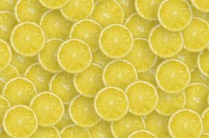 Pattern of yellow lemon citrus slices. Citrus flat lay photo