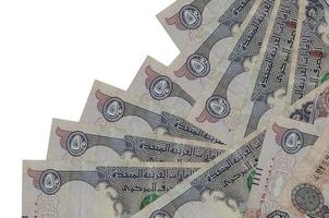 50 UAE dirhams bills lies in different order isolated on white. Local banking or money making concept photo