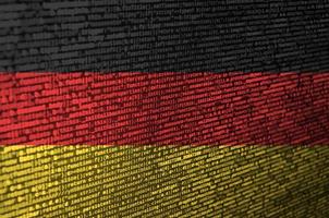 Germany flag is depicted on the screen with the program code. The concept of modern technology and site development photo