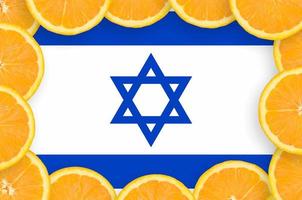 Israel flag in fresh citrus fruit slices frame photo