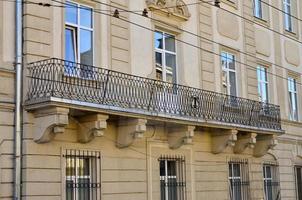 Image of an old wrought-iron frame on the balcony of a multi-storey building in Lviv, Ukraine photo