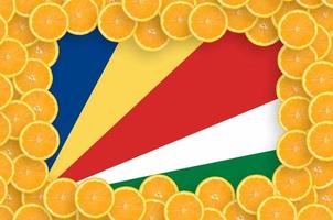 Seychelles flag in fresh citrus fruit slices frame photo