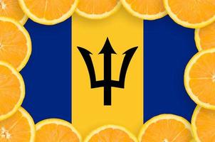 Barbados flag in fresh citrus fruit slices frame photo