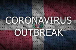 Dominican Republic flag and Coronavirus outbreak inscription. Covid-19 or 2019-nCov virus photo