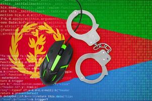 Eritrea flag and handcuffed computer mouse. Combating computer crime, hackers and piracy photo