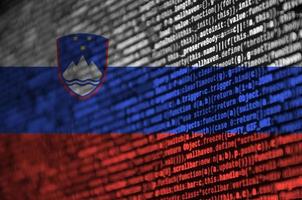 Slovenia flag is depicted on the screen with the program code. The concept of modern technology and site development photo