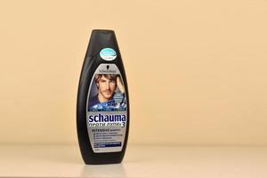 KHARKOV, UKRAINE - MAY 3, 2022 Schwarzkopf schauma shampoo plastic bottle for men. Cosmetics company Hans Schwarzkopf GmbH was acquired by Henkel in 1995 photo