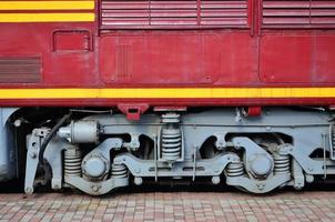 The wheels of a modern Russian electric train with shock absorbers and braking devices. The side of the cab photo