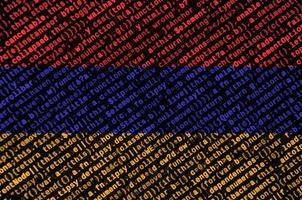Armenia flag is depicted on the screen with the program code. The concept of modern technology and site development photo