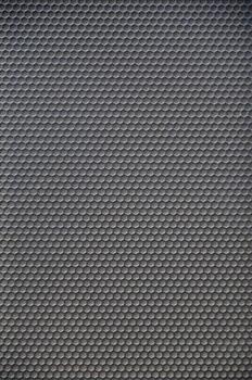 Abstract black metallic mesh texture pattern for Industrial background. Speaker of musical column and free space for text photo