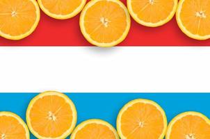 Luxembourg flag in citrus fruit slices horizontal frame photo