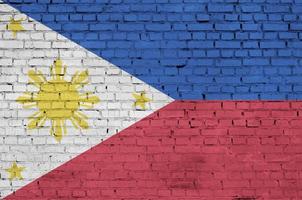 Philippines flag is painted onto an old brick wall photo