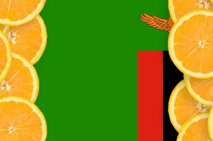 Zambia flag in citrus fruit slices vertical frame photo