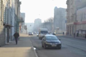 Blurred landscape of highway with cars in foggy morning photo