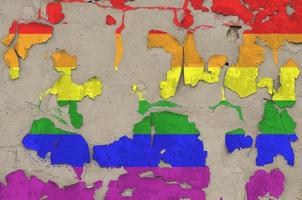 LGBT community flag depicted in paint colors on old obsolete messy concrete wall closeup. Textured banner on rough background photo