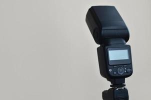 Speedlight gun with trigger set mounted on tripod photo