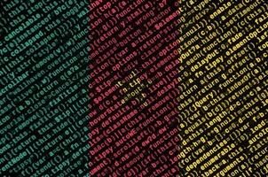 Cameroon flag is depicted on the screen with the program code. The concept of modern technology and site development photo