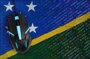 Solomon Islands flag and computer mouse. Digital threat, illegal actions on the Internet photo