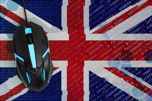 Great britain flag and computer mouse. Digital threat, illegal actions on the Internet photo
