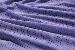 Texture of sportswear made of polyester fiber. Outerwear for sports training has a mesh texture of stretchable nylon fabric photo