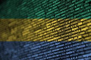 Gabon flag is depicted on the screen with the program code. The concept of modern technology and site development photo
