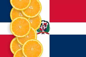 Dominican Republic flag and citrus fruit slices vertical row photo