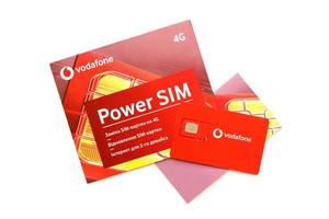 TERNOPIL, UKRAINE - JULY 5, 2022 Vodafone Power SIM mobile card by Vodafone group plc - British multinational telecommunications company who operates networks in 22 countries photo